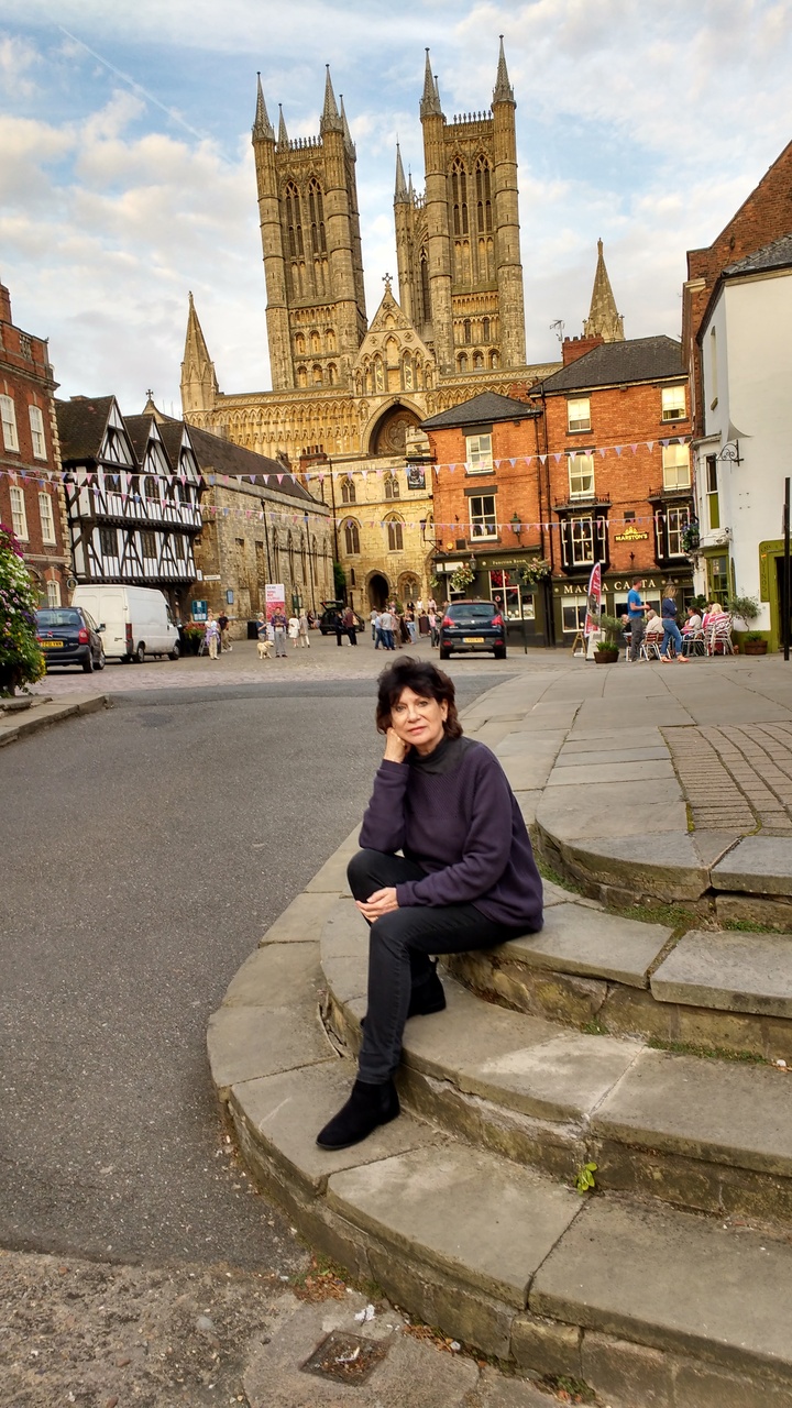 Author sitting in Castle Square with Lincoln Cathedral in the background. July 2016.